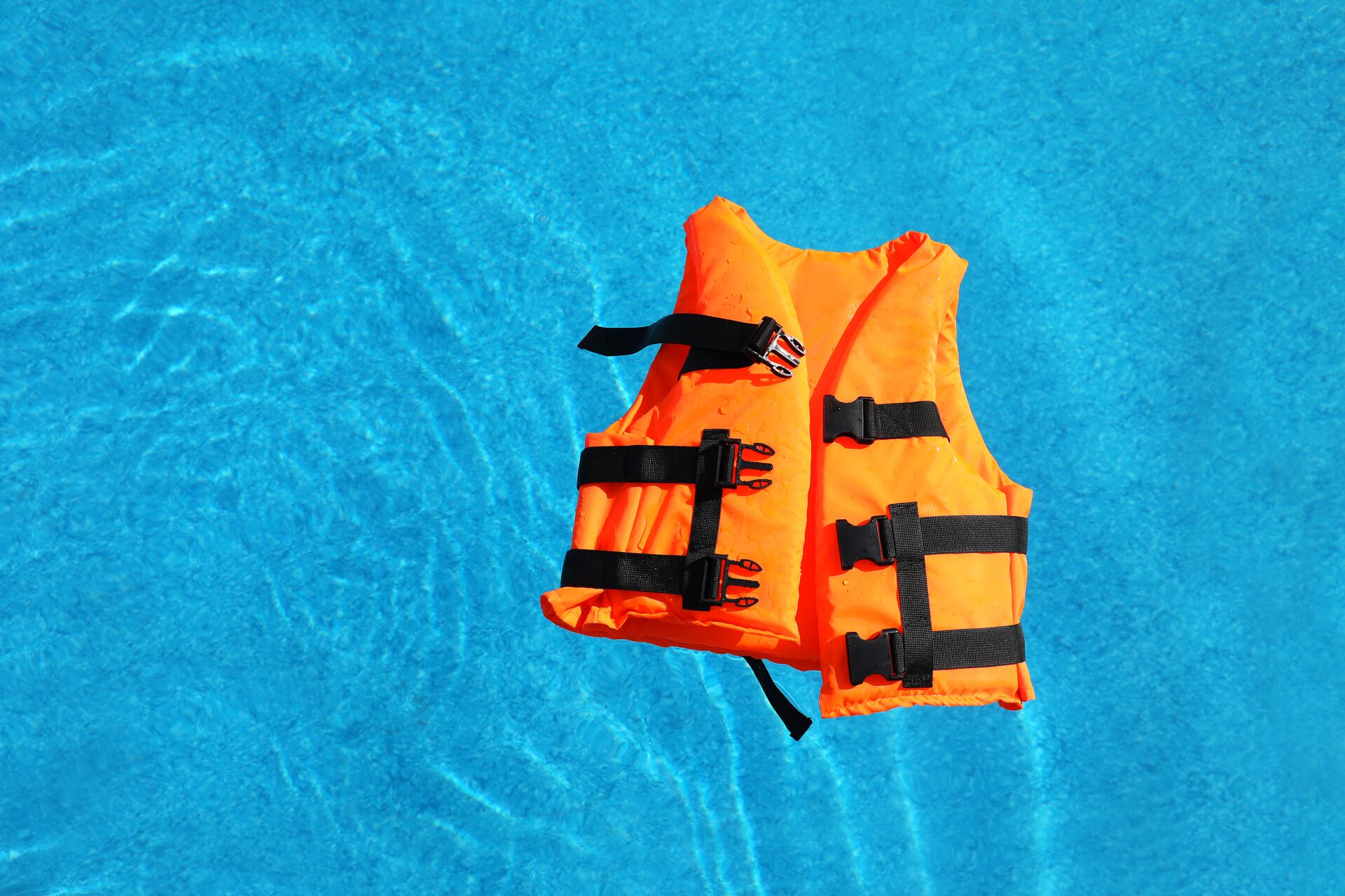 A lifejacket floats on the water, staying safe with paddlesports. 