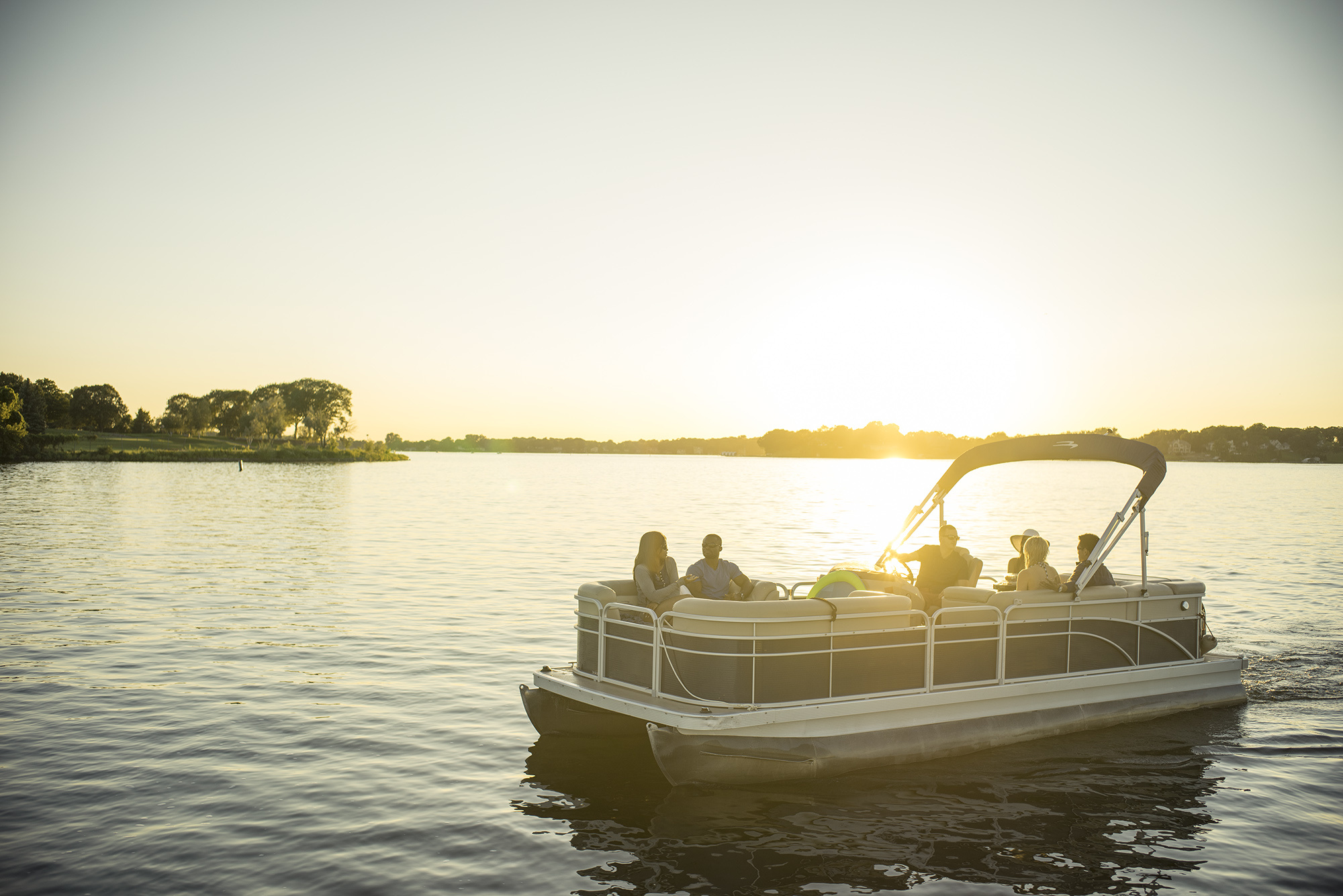 People on a pontoon boat on a lake, Lake of the Ozarks concept. 