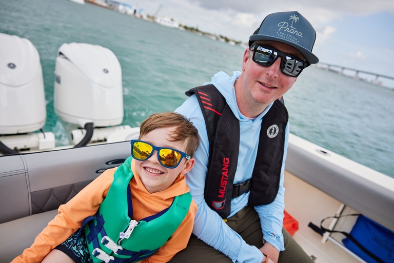 A father and son on a boat, Father's Day gifts for boat owners concept. 