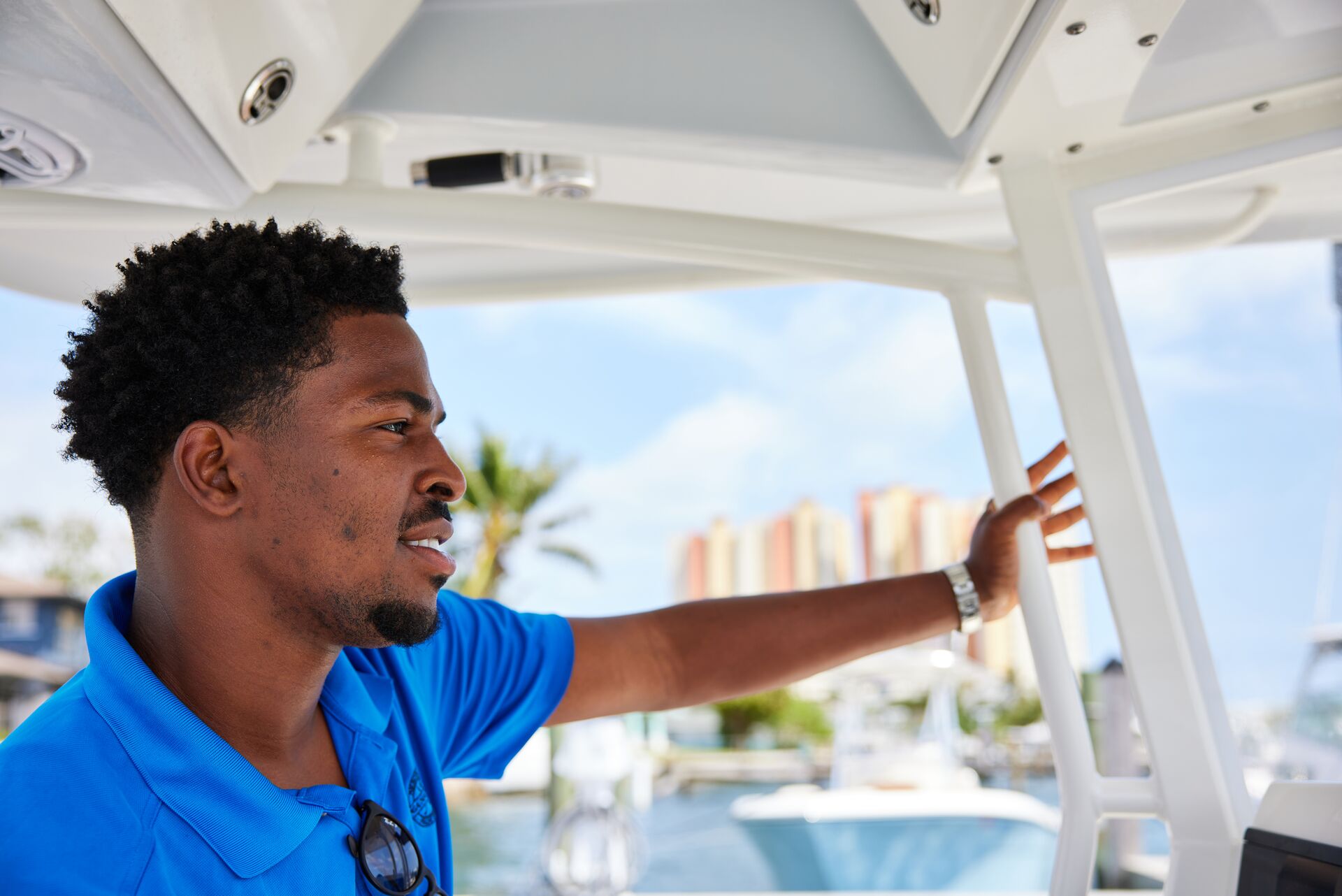 A man in a life jacket drives a boat, boat safety concept. 