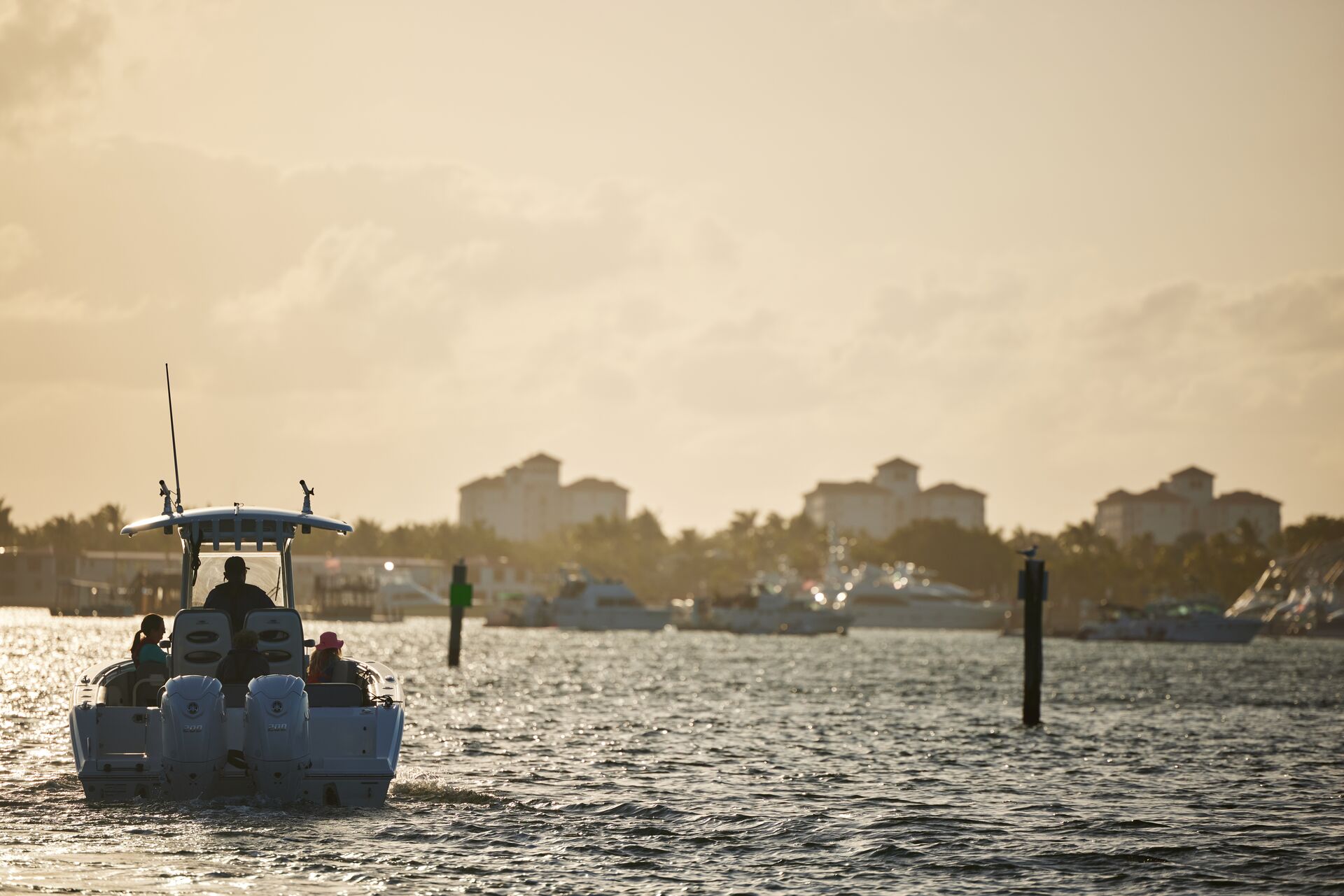 The back of a boat driving away on the water, boat stern lights concept. 