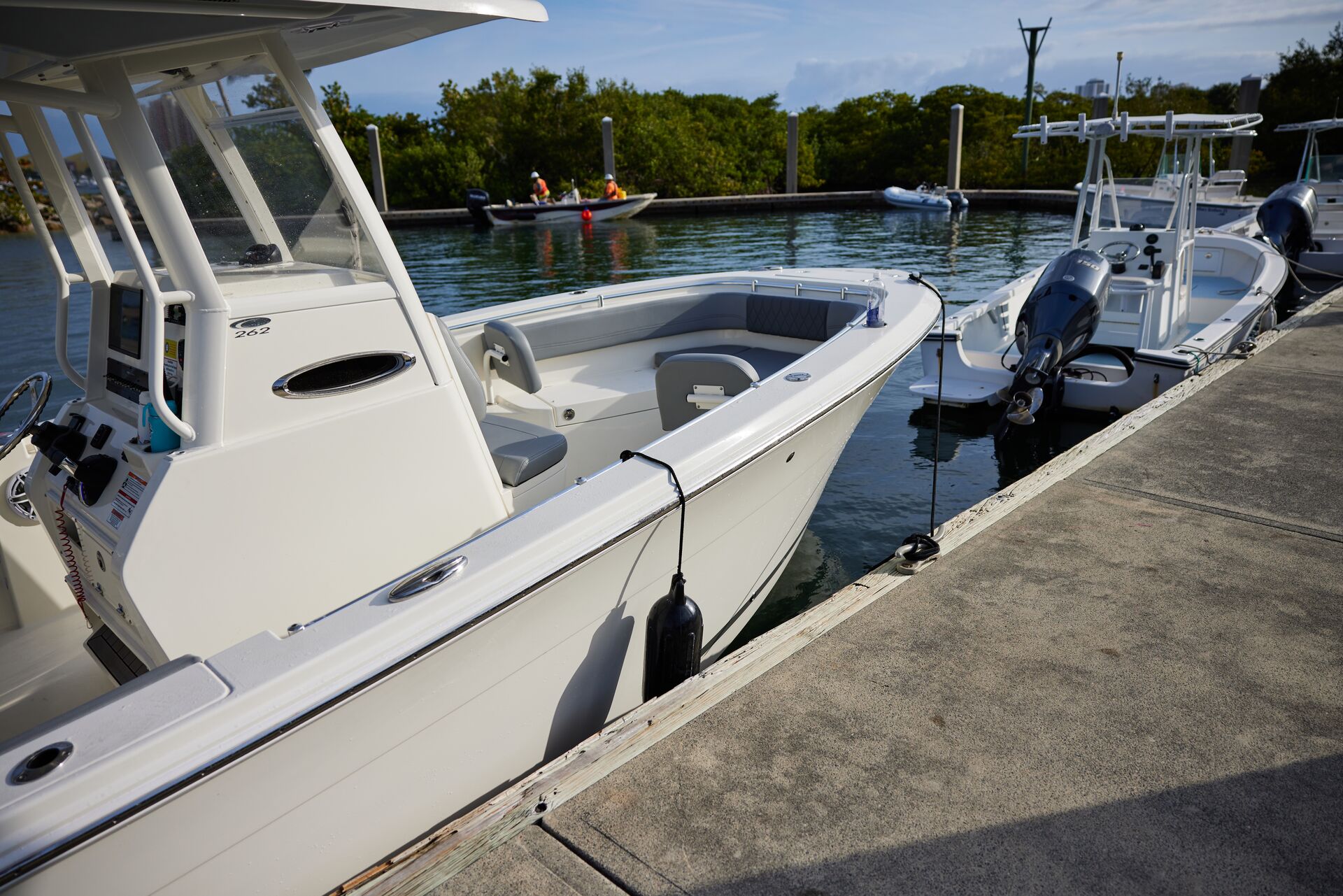 Boats at a dock, center console boat concept. 