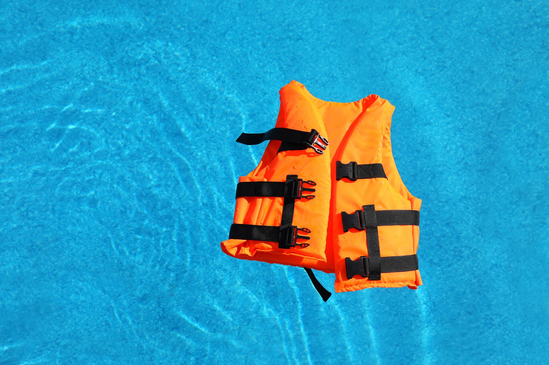 A life jacket floating on the water. 