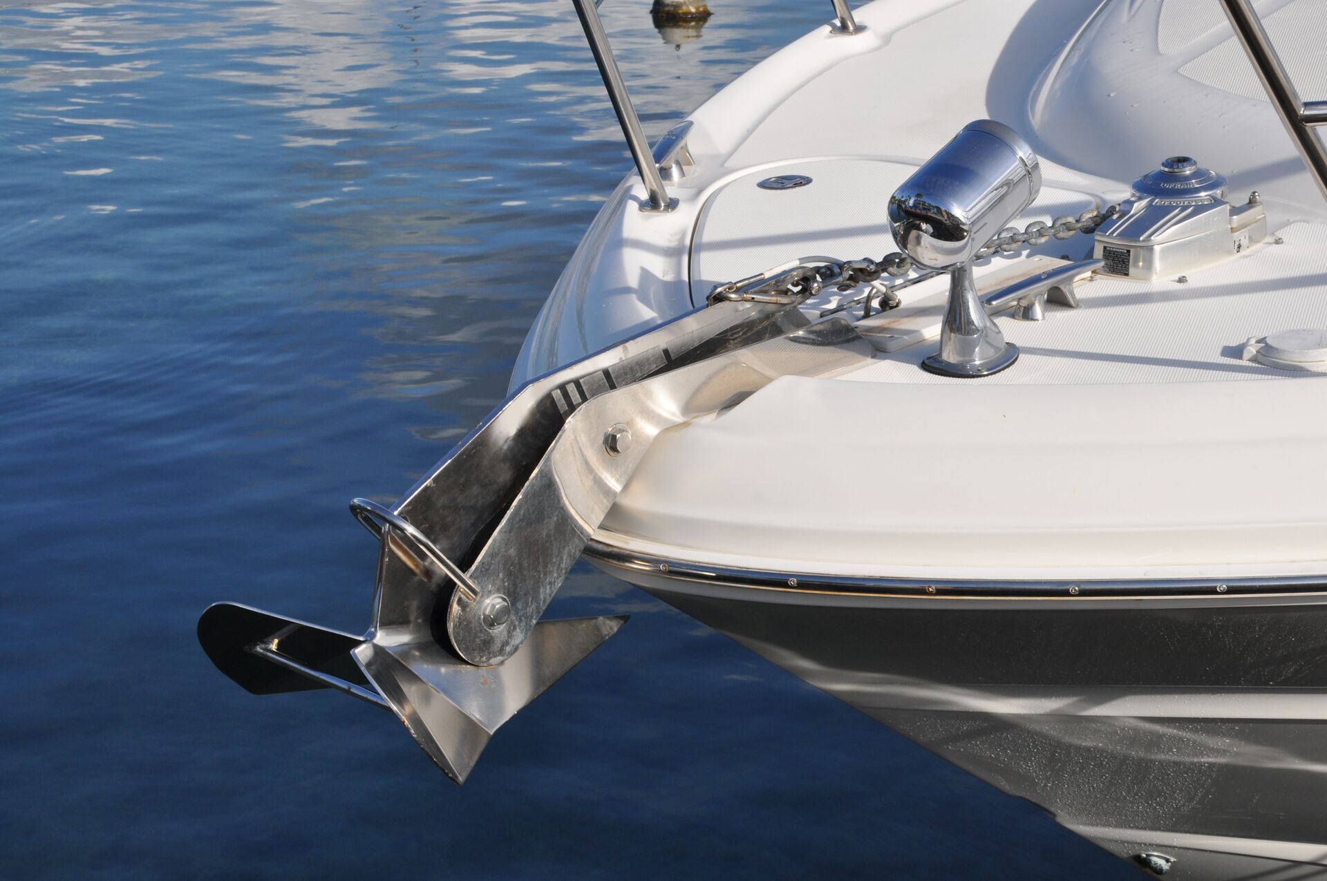 Close-up of an anchor on the front of a boat. 